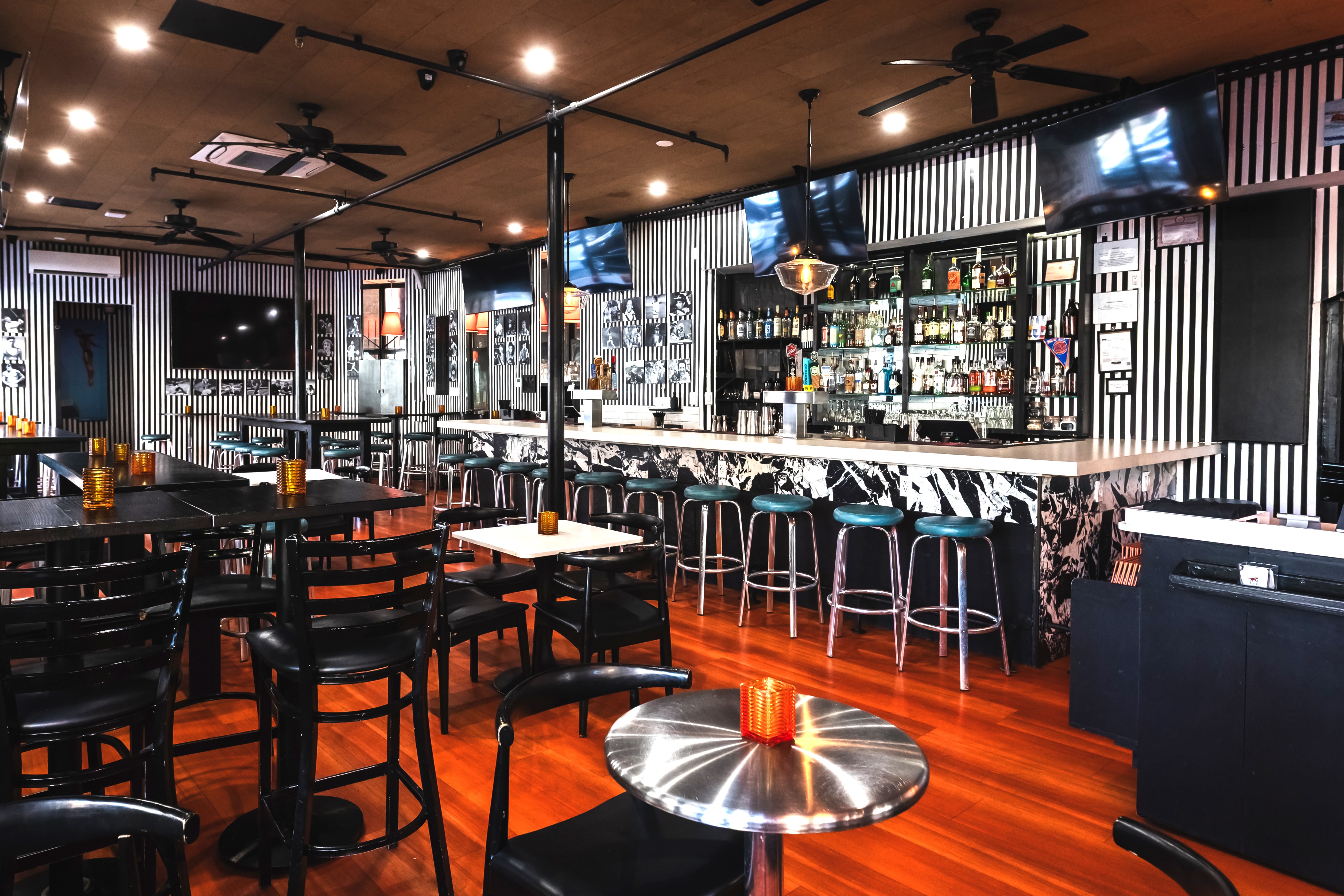 The Fox bar and tables and open seating, sports theme design