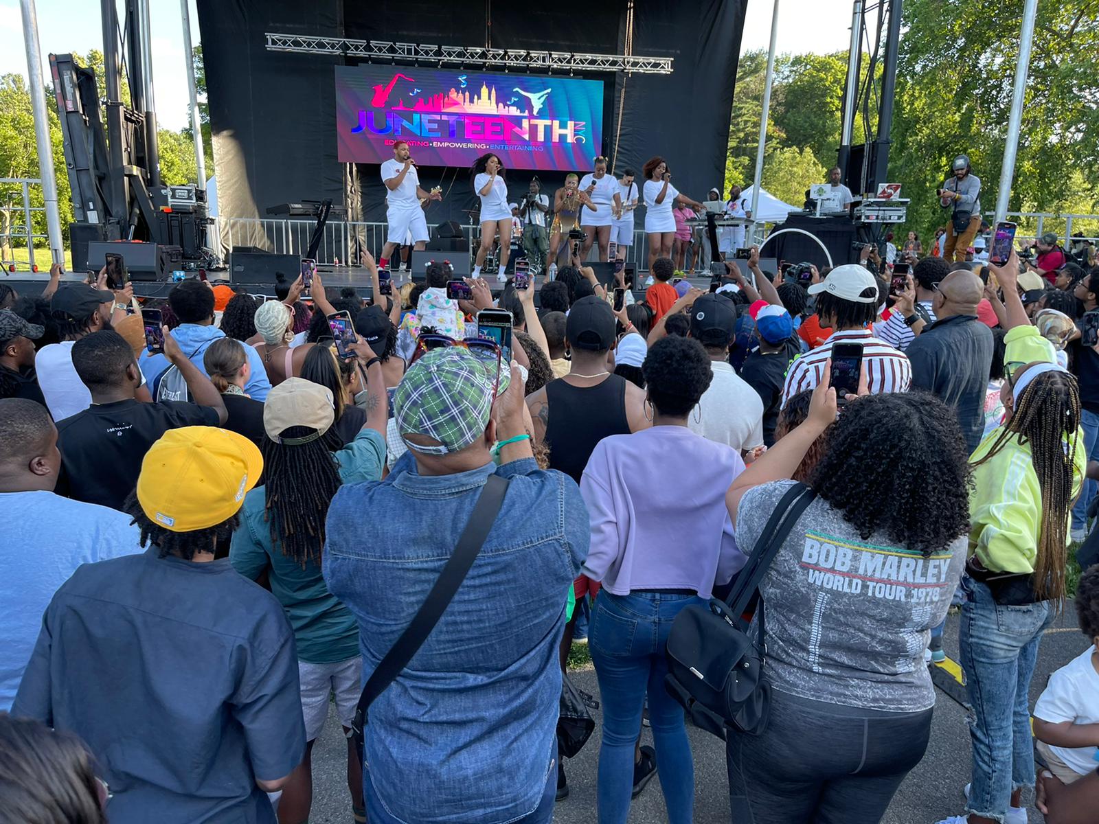 Crowd gathered at the Juneteenth NYC Festival in Brooklyn watching live performers on stage during a community celebration of freedom, culture, and music.