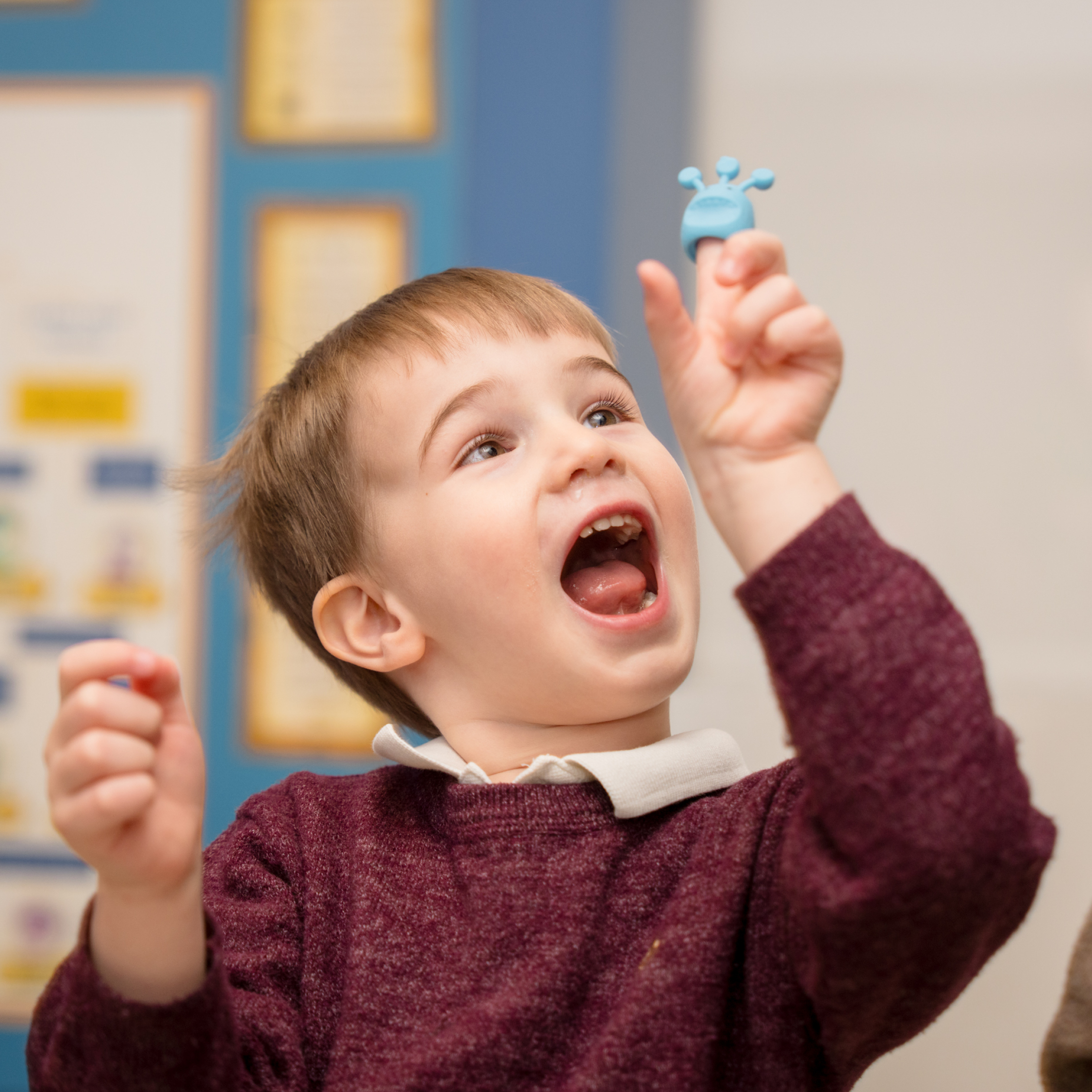 child with a finger puppet