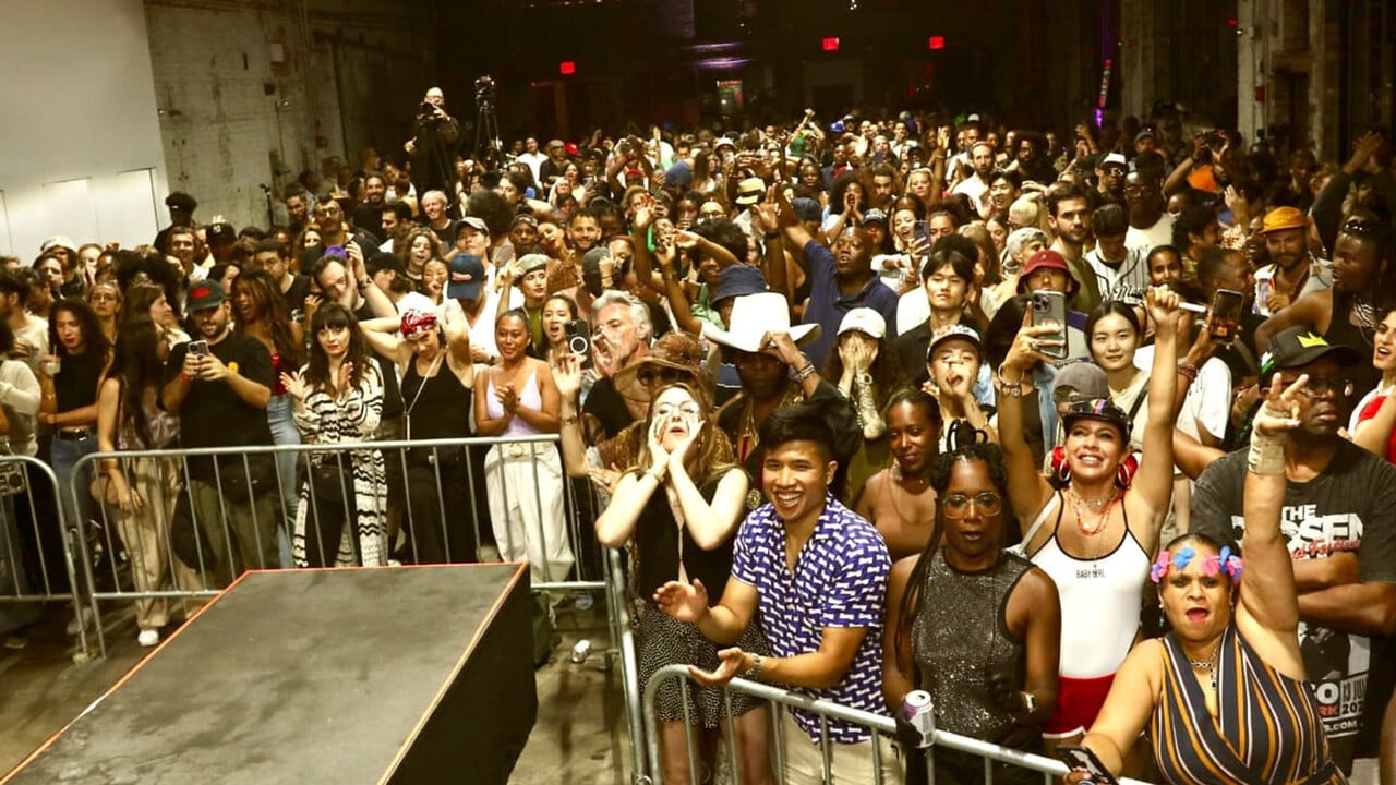 A large crowd of people infront of a stage